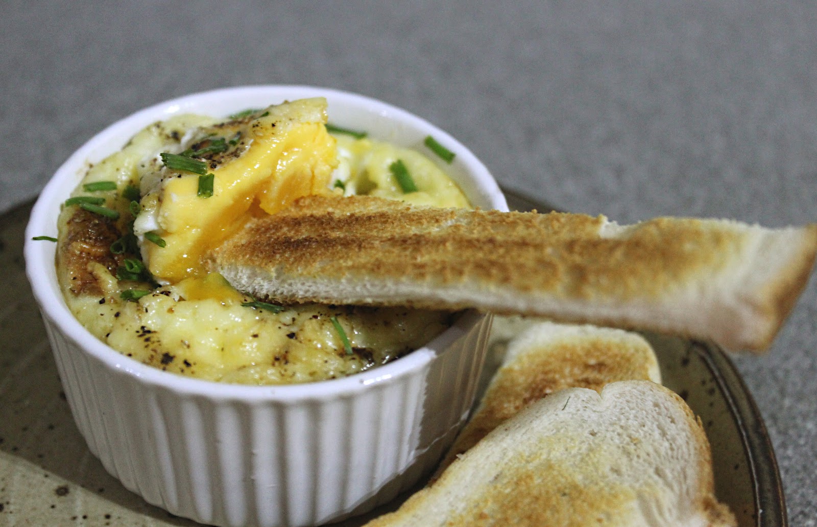 Cheese and tomato baked eggs with soldiers Amuse Your Bouche