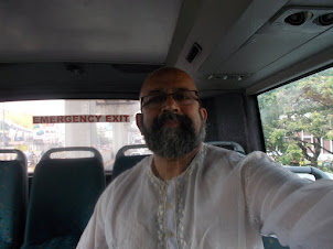 On a A/c "KSRTC" bus to 'Lulu Mall' on Edapally road.