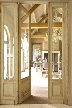 Mansion in Belgium with reclaimed glass doors between kitchen living room