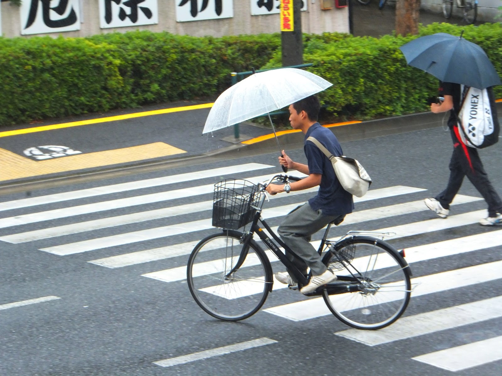 Rainy Day Cyclists in Tokyo