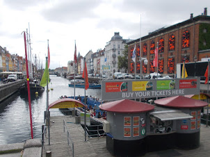 Nyhavn :- Indescribable natural Port harbour with tall tourist sail boats and canal side restaurant