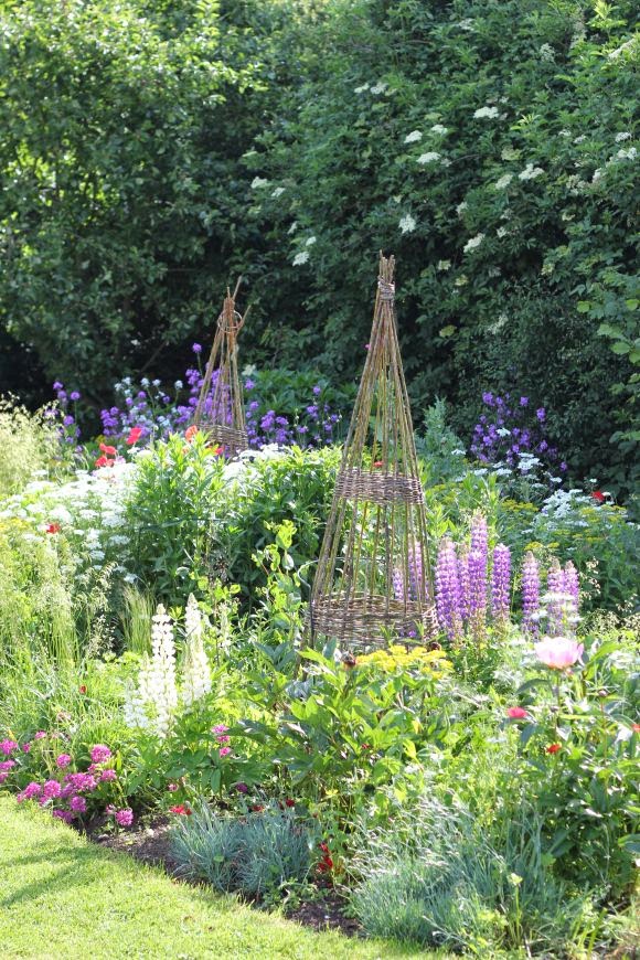 Obelisks in a cottage garden Backyards Click