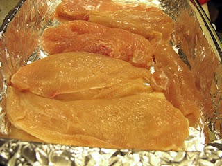 Uncooked chicken breasts.