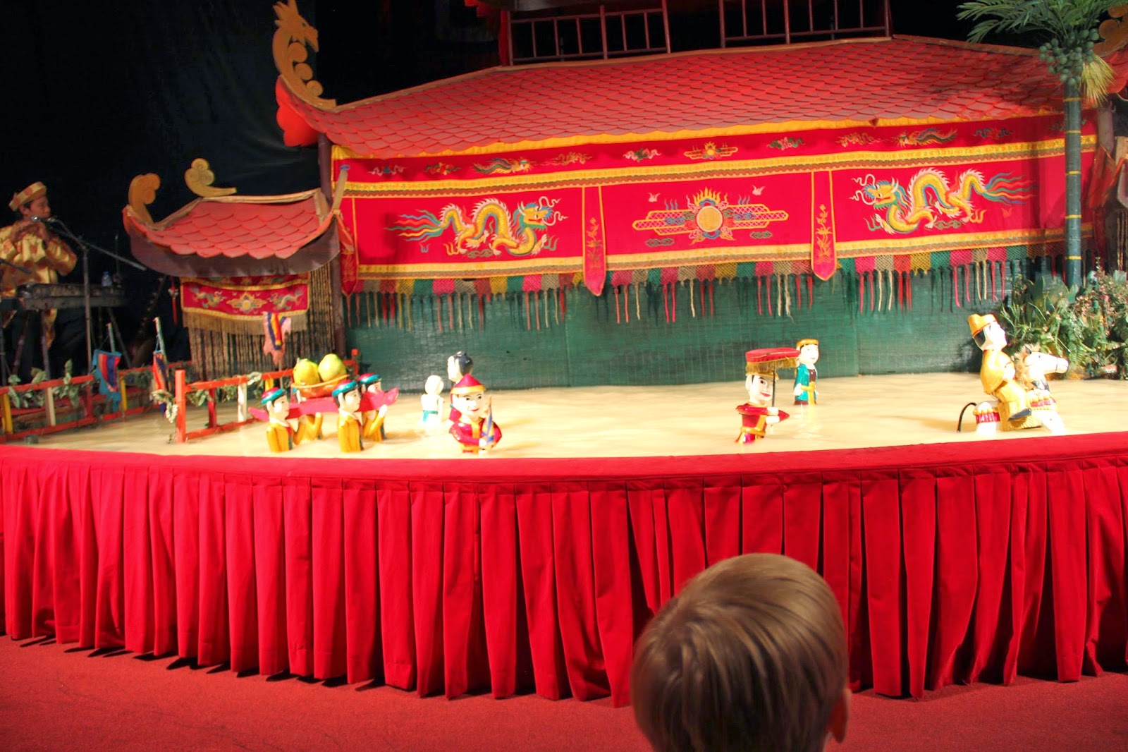 A performance at the Golden Dragon Water Puppet theater. A performance at the Golden Dragon Water Puppet theater.
