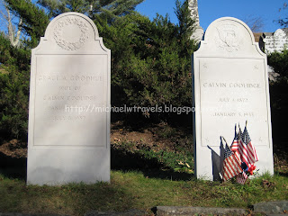 a headstone with flags on it