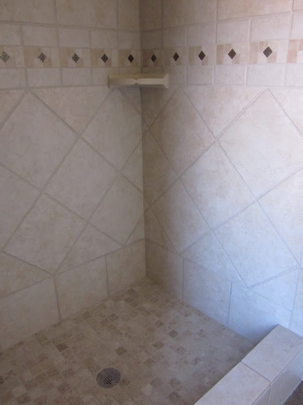 corner shot of 12x12 porcelain shower, 2x2 mosaic floor and corner title=
