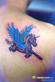 Comic style flying horse tattoo on the back