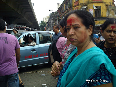 Red mark on the foreheads of devotees at the Lalbaugcha Raja Ganpati Mandal