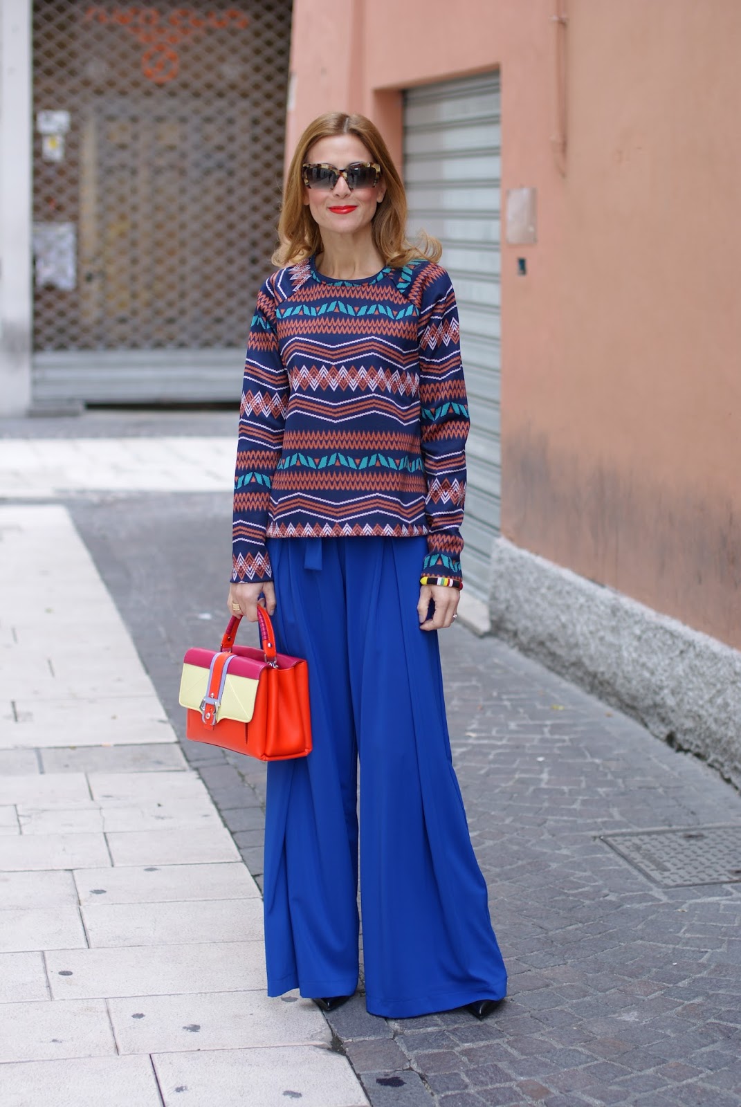 Colorful outfit with wide leg palazzo pants and Paula Cademartori Petite Faye bag on Fashion and Cookies fashion blog, fashion blogger style