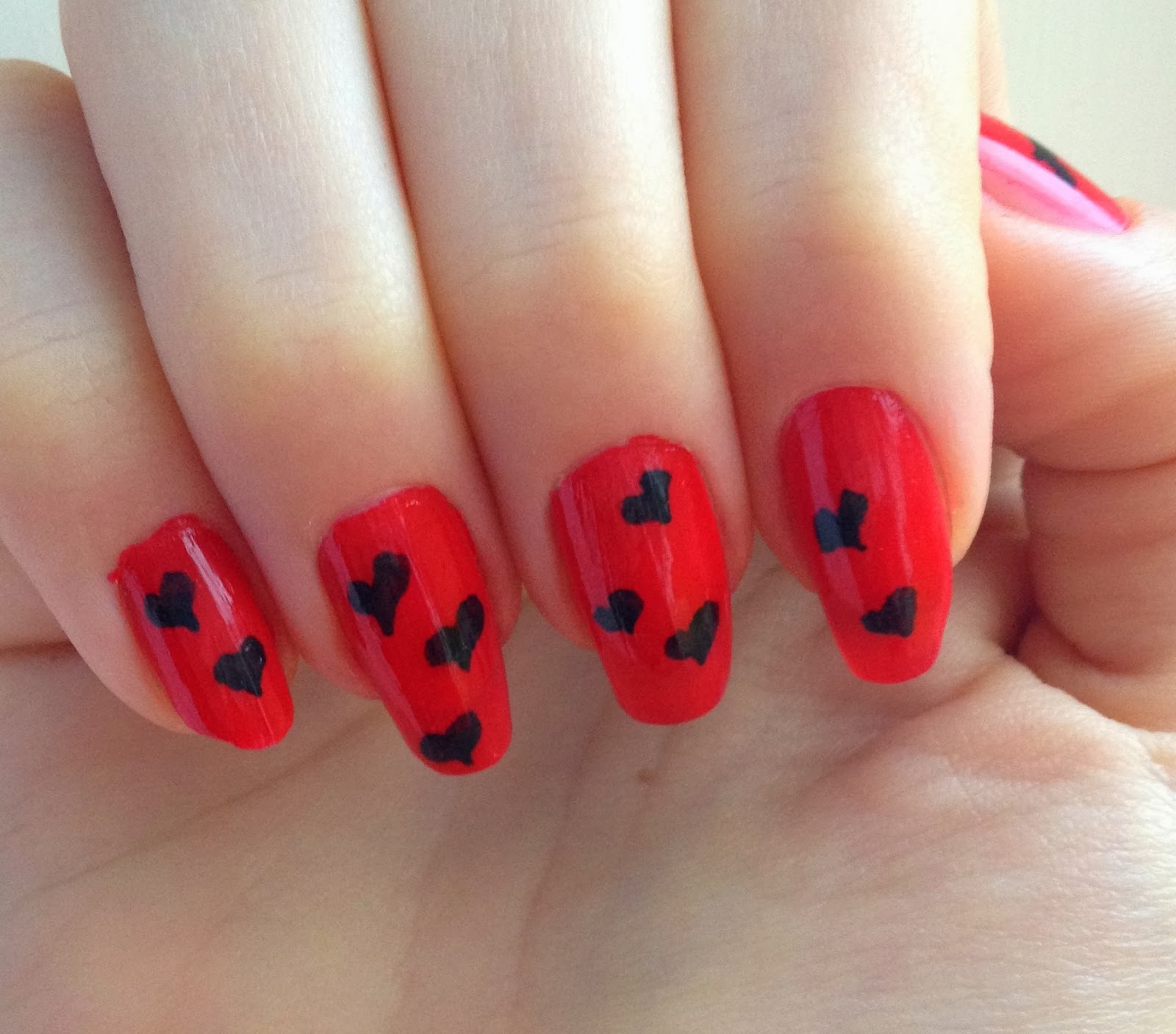 red-and-black-heart-nails
