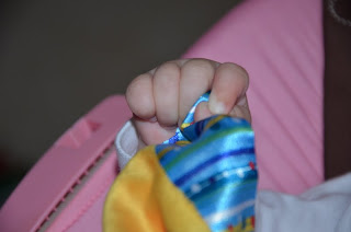 Cute baby hands Bright Starts Cuddle & Soothe Blanket.
