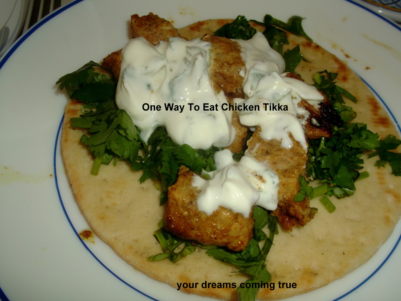 Chicken Tikka Kebabs With Cilantro, Raita On Pitta Bread.