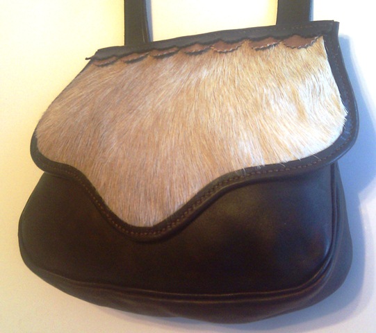 "Ridgemont" pouch with goat hair flap, gusset, roll welted