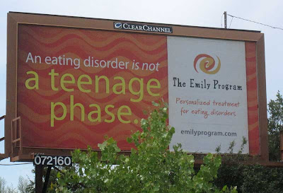 Orange and yellow billboard reading An eating disorder is not a teenage phase