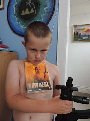 underage boy with mp5 machine gun and 18 rated movie