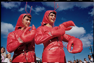 Two girls wearing lobster costumes outside