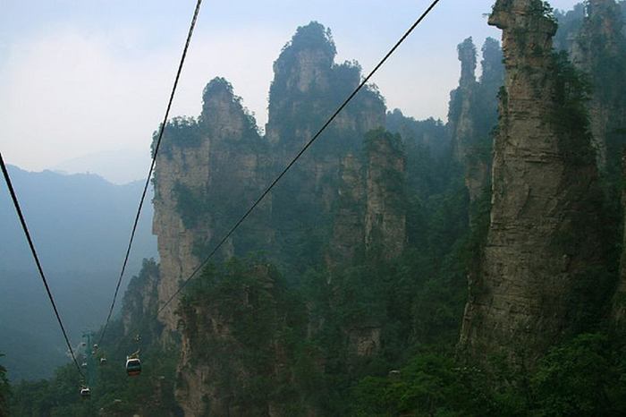 Wulingyuan - cliffs in Zhangjiajie National Park, which is located in Hunan Province in the southeast of China. This is a place of amazing beauty and at the same time a natural zoo, botanical and geological reserve. The place is famous for its quartzite cliffs up to 800 meters. The highest peaks of Wulingyuan reach a height of more than 3 km above sea level. Mountains are a picturesque sight: the huge stone pillars above the rainforest cut by sharp peaks, waterfalls, a giant cave system. 