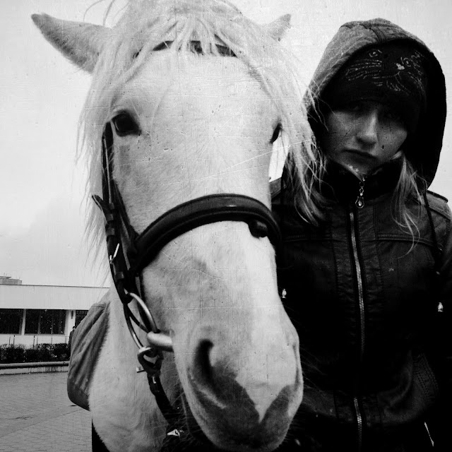 The girl with white horse near Komarovka market - Minsk, Belarus