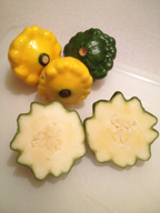 Patty pan squash cut at the widest part to reveal the scalloped edge
