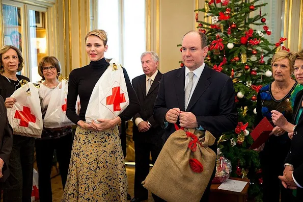 Prince Albert and princess Charlene of Monaco presented gifts to old people and children at "Red Cross" Monaco branch