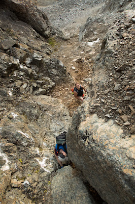 Phil and Phil scrambling down the tough section of the choss gully