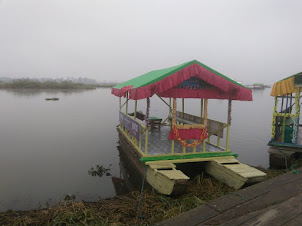 Cute small motorized boats for tourist boat rides on Loktak lake.