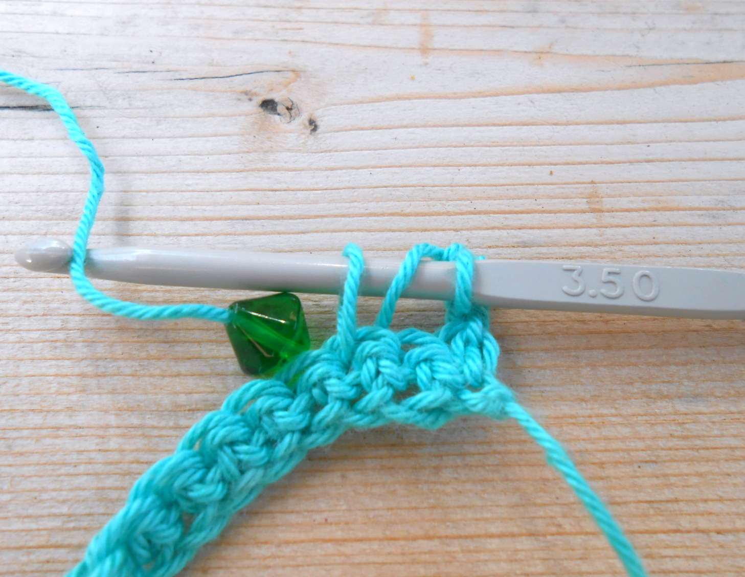 tr into next 2 stitches then a beaded treble, continue from ...