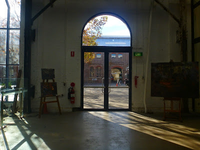 Exhibition of oil paintings in blacksmith's workshop, Eveleigh Railway Workshops painted during ATP Open Day by industrial heritage artist Jane Bennett