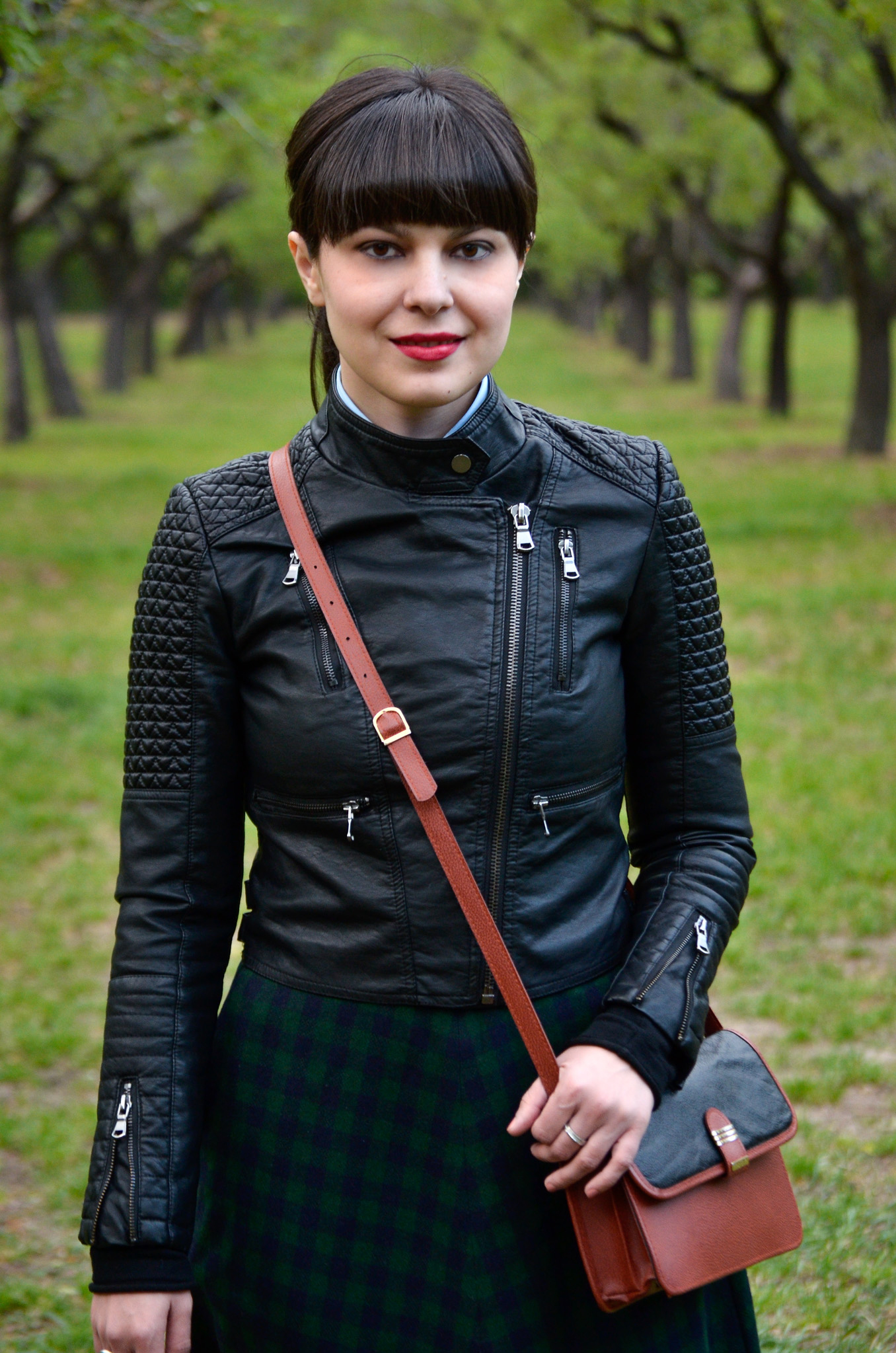 school girl outfit in madrid green tartan midi skirt thrifted brown bag satchel sky blue shirt black bow tie bangs burgundy oxford shoes poema spring green fresh park