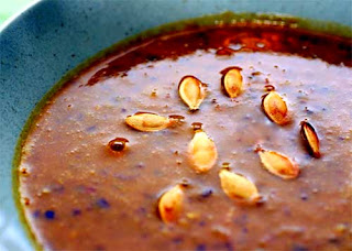 Black Bean and Pumpkin Soup: Classic 'winter warming' soup for Halloween that uses black beans and pumpkin as its base and which is served garnished with toasted pumpkin seeds
