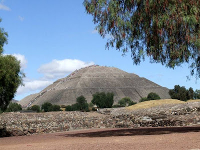 Pyramid of the Sun in Teotihuacan — Mexico Pyramid of the Sun, It was massive, one of the first great cities of the Western Hemisphere. And its origins are a mystery. It was built by hand more than a thousand years before the swooping arrival of the Nahuatl-speaking Aztec in central Mexico. But it was the Aztec, descending on the abandoned site, no doubt falling awestruck by what they saw, who gave it a name: Teotihuacan. A famed archaeological site located fewer than 30 miles (50 kilometers) from Mexico City, Teotihuacan reached its zenith between 100 B.C. and A.D. 650. It covered 8 square miles (21 square kilometers) and supported a population of a hundred thousand, according to George Cowgill, an archaeologist at Arizona State University and a National Geographic Society grantee.