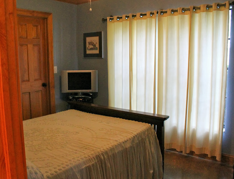 BEDROOM #2: 10’ X 11 ½’ W/POLISHED, STAINED CONCRETE FLOOR title=