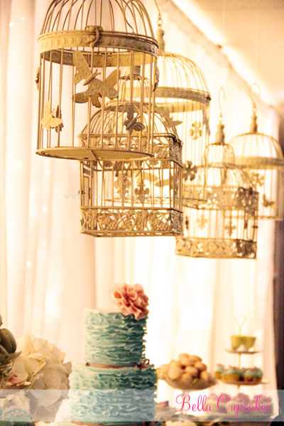 I loved the hanging bird cages with the back drop of fairy lights