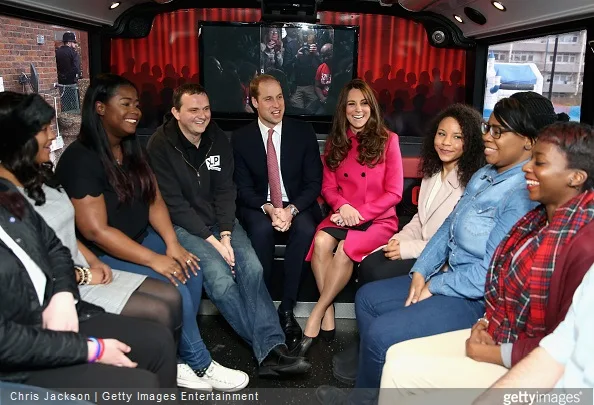 Catherine, Duchess of Cambridge and Prince William, Duke of Cambridge joke with young people on the top deck of the XLP Mobile recording Studio