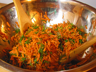 Carrot Dill Salad and Mixing Tongs in Stainless Steel Bowl
