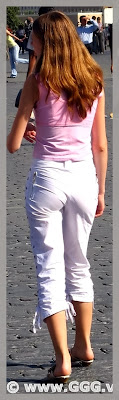 Girl in white breeches on the street