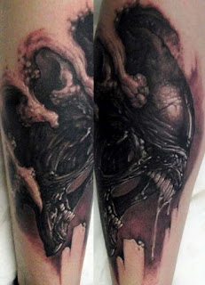 3D tattoo: the Alien monster coming out through the skin