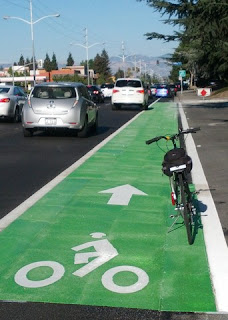 Commute bike posing in the fancy new green bike lane.