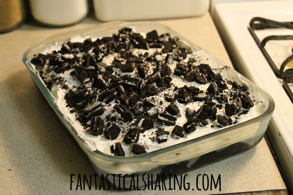 Better Than Anything Oreo Poke Cake | Chocolate cake with hot fudge, Cool Whip, and tons of Oreo cookies #dessert