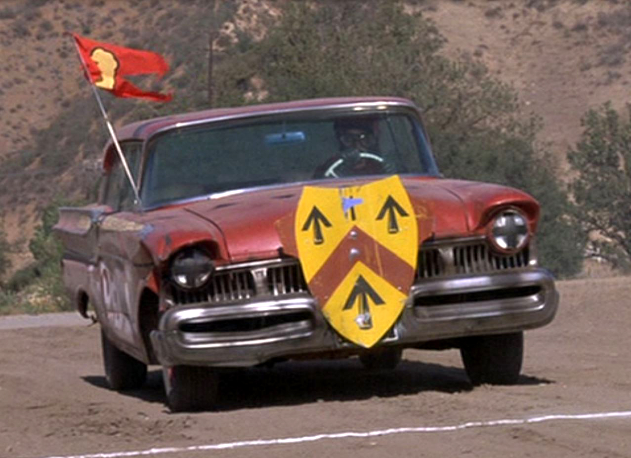 a screen shot from the Chicken Race scene in Herbie Rides Again CARS