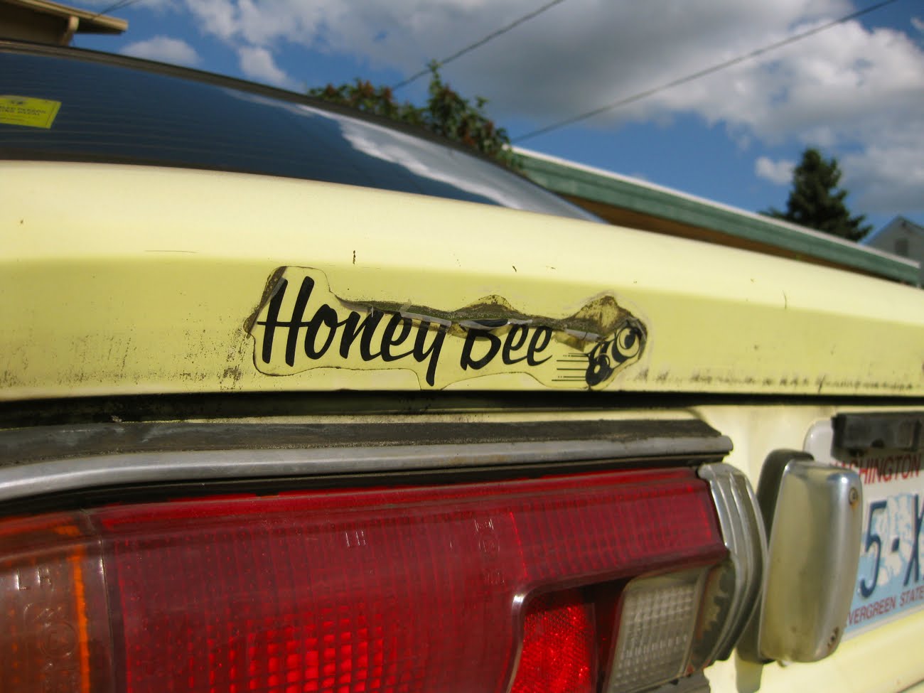 OLD PARKED CARS. 1977 Datsun Honeybee B210.