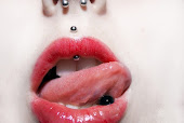 Piercings.