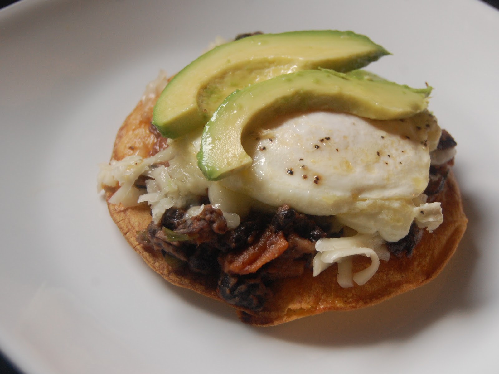 Cassie Craves Fried Egg Tostadas with BaconBlack Bean Mash