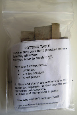 Dolls' house miniature potting table kit in packaging.