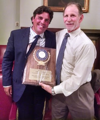 Richard A. Klass (l) presents award to Lew Tesser for service to the New York State Bar Association.
