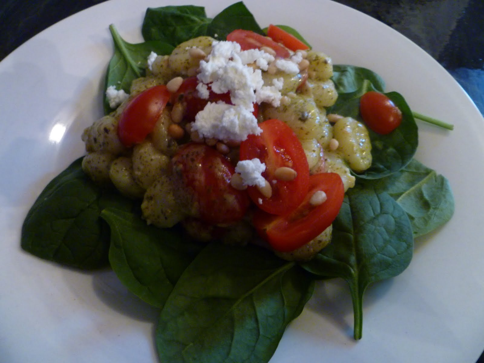 The Gourmet Student Gnocchi with a Pesto Cream Sauce, Cherry Tomatoes