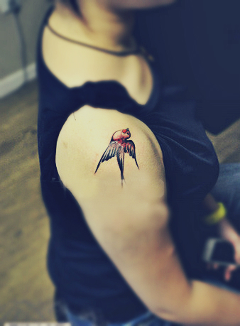 swallow tattoo on the arm
