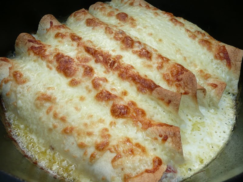Everyday Dutch Oven Creamy Chicken Enchiladas