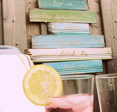 colorful hand painted sign made from old baseboards