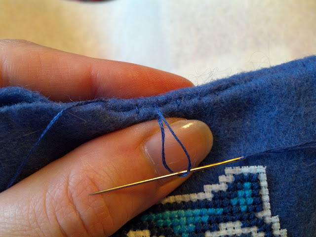 Tighten the stitches one by one to close the seam and hide the thread